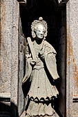 Bangkok Wat Arun - Details of the statues of Chinese saints of the pagoda at the corners of the Ubosot coutyard. 